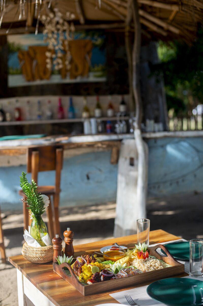 The bar at Cterra Saadani, laid out under the makuti roof