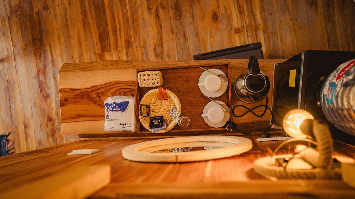 Inside a dome — Beds, headboards and the wood-and-canvas interiors of the domes, tent by tent.