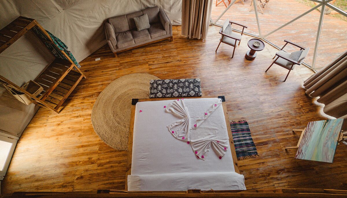 Inside a dome — Beds, headboards and the wood-and-canvas interiors of the domes, tent by tent.