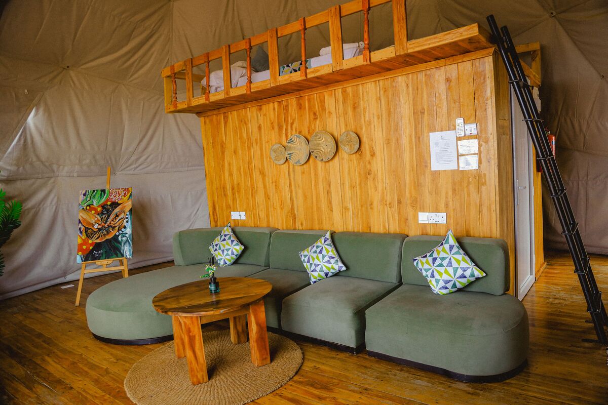 Inside a dome — Beds, headboards and the wood-and-canvas interiors of the domes, tent by tent.