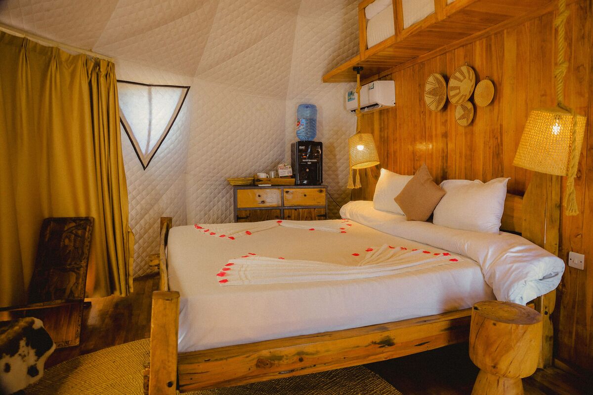 Inside the second Standard tent at Cterra Saadani, with the woven bowls and the mirror