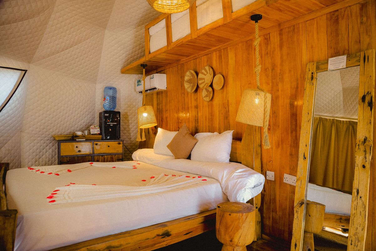 Inside the second Standard tent at Cterra Saadani, with the woven bowls and the mirror