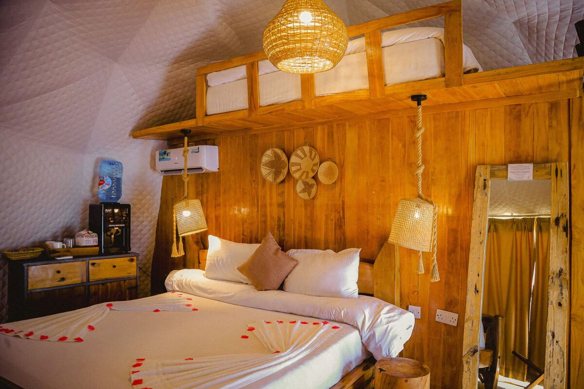Inside the second Standard tent at Cterra Saadani, with the woven bowls and the mirror