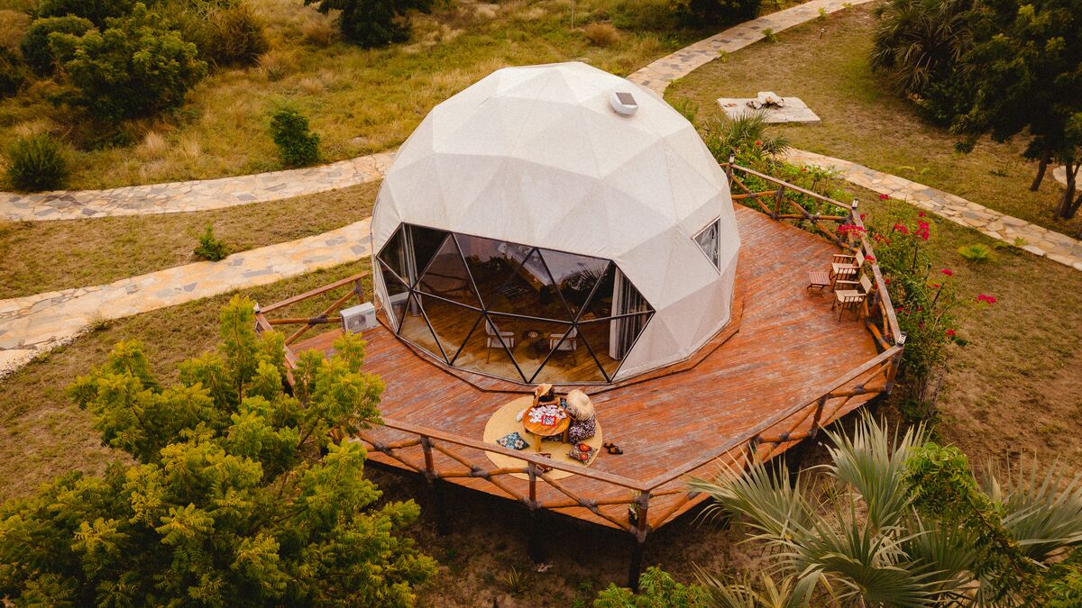 A dome tent and its private deck above the coastal bush