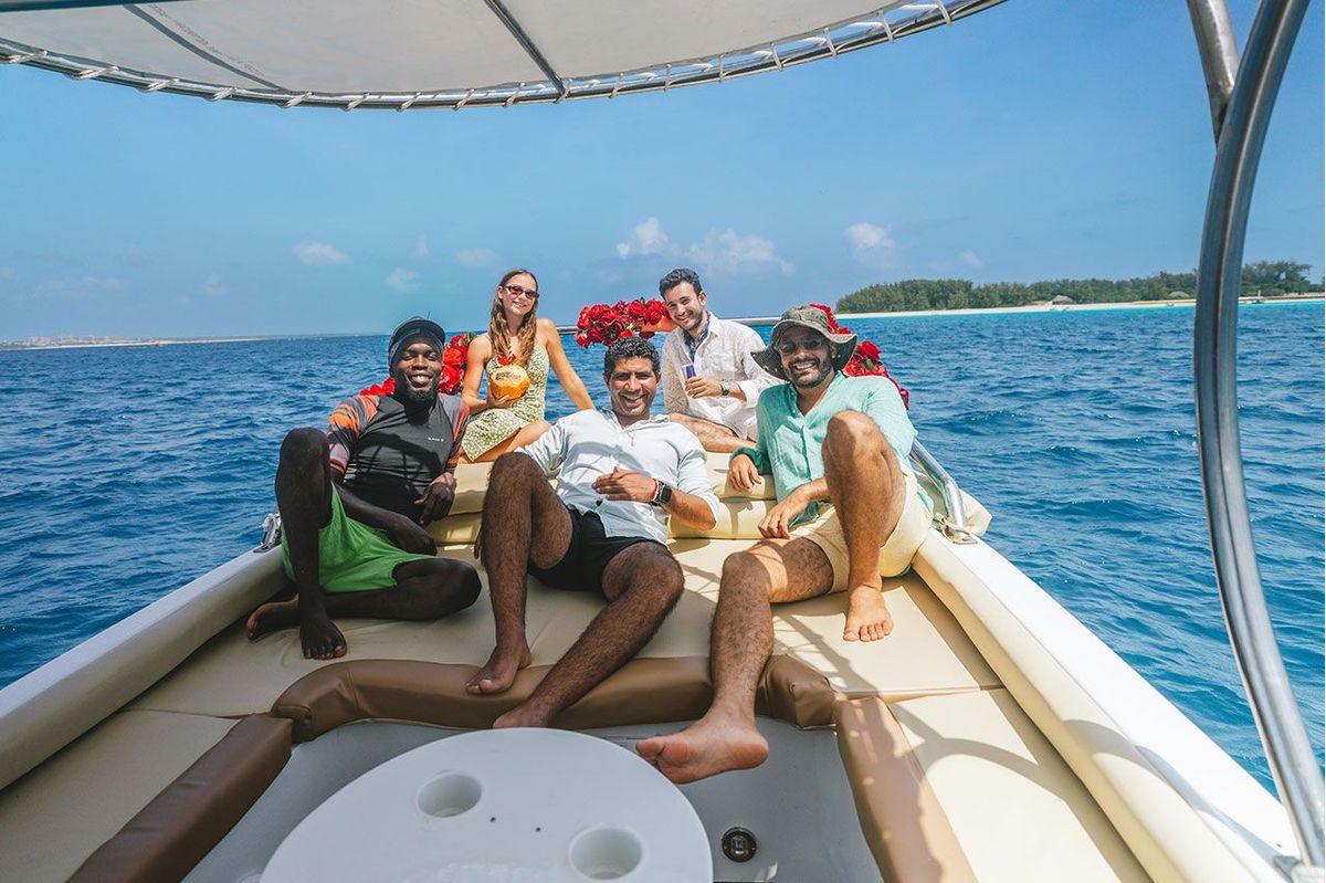Guests and crew stretched out on the bow cushions as the boat lies at anchor